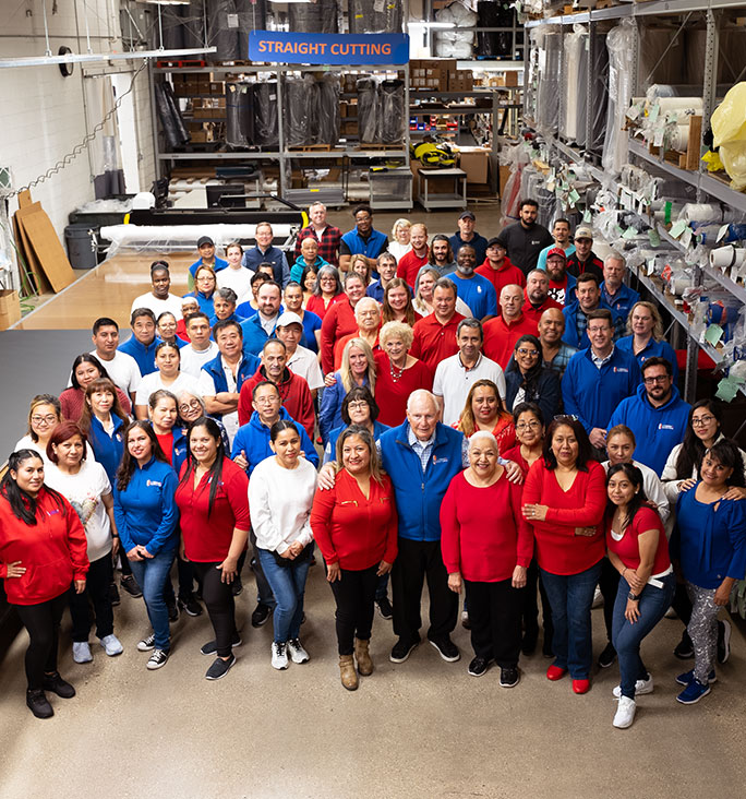 company photo, an overhead view of LJ staff in the warehouse