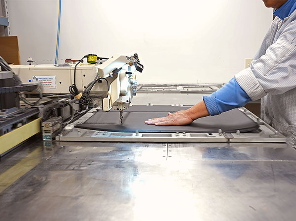 person using industrial sewing machine